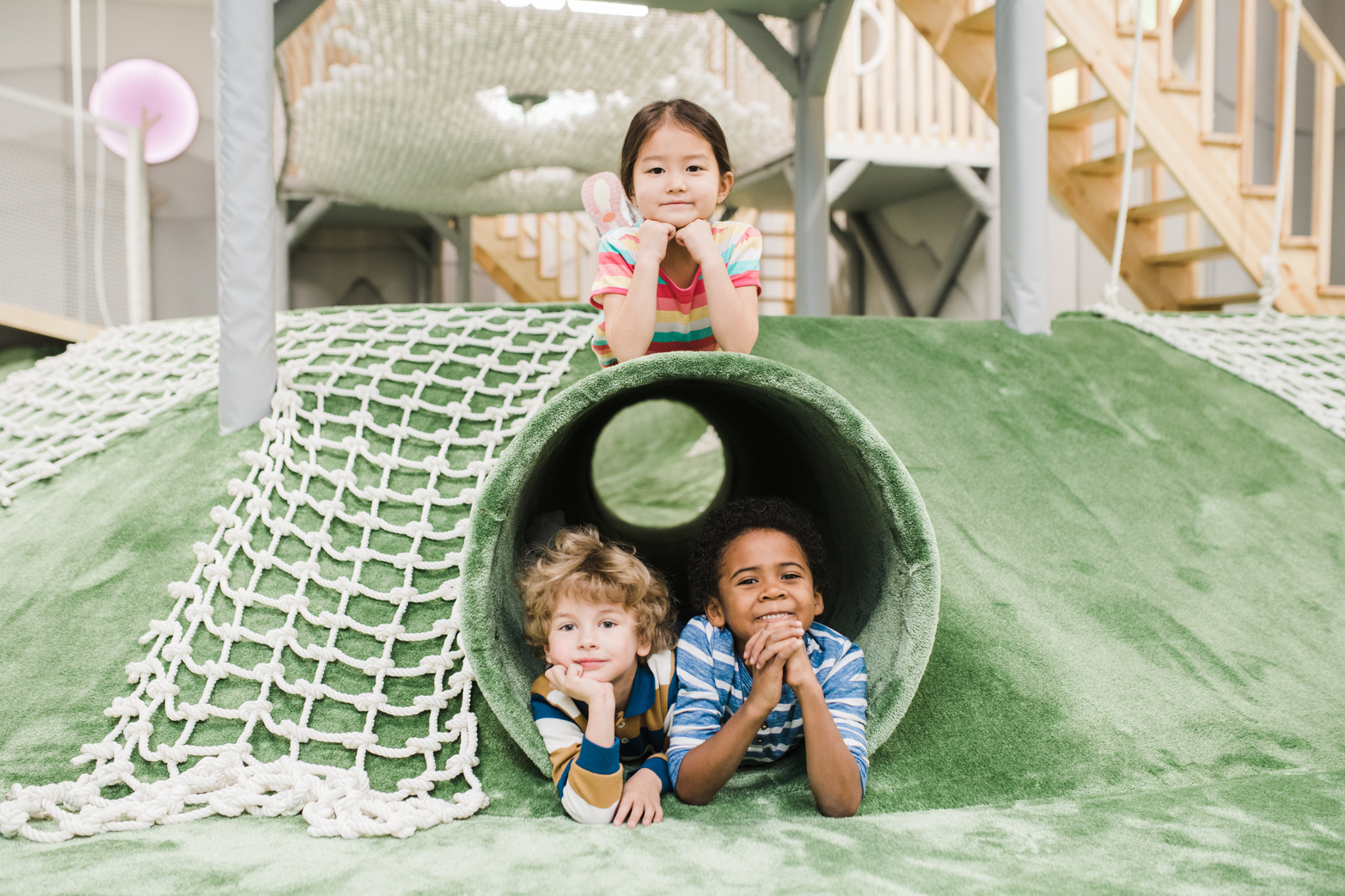 Children playing together in a preschool play space